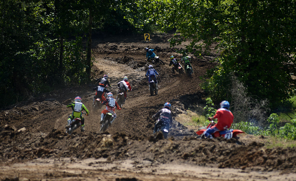 Adult racers climb the first hill of the track